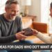 Father in a cozy living room joyfully opening a leather wallet gift from his child, with overlay text reading ‘15 Gift Ideas for Dads Who Don’t Want Anything.’