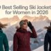Posing on a sun-lit snowy ridge in ski jackets, alpine peaks glowing behind them, headline text across sky reads: ‘The 9 Best Selling Ski Jackets for Women in 2026.