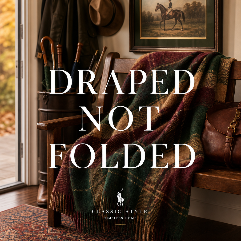 Plaid wool throw draped over an entryway bench